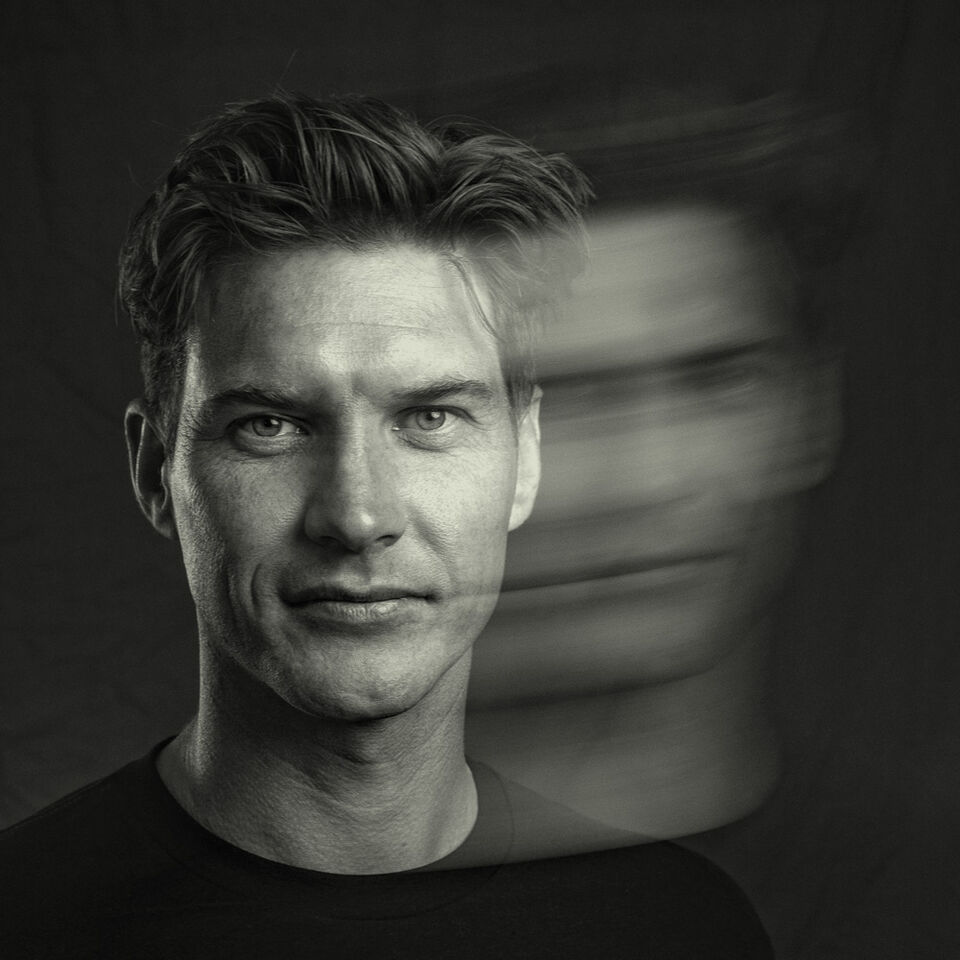 Black and white portrait of Greg Minnaar