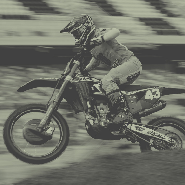 Fox athlete Ken racing on a moto